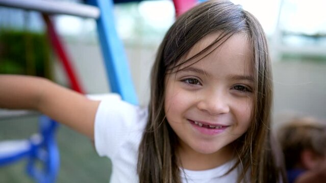 Child showing missing teeths portrait little girl teeth grow