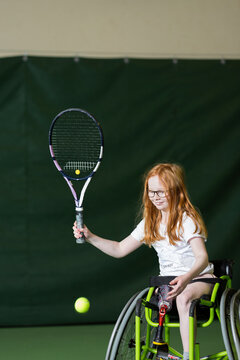 Girl In Wheelchair Playing Tennis