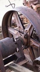 Fototapeta na wymiar Rusty metal wheel on equipment