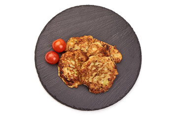Fried zucchini pancakes, isolated on white background.