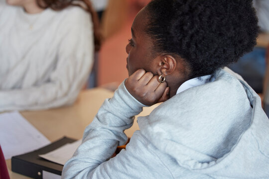 Female student sitting in class