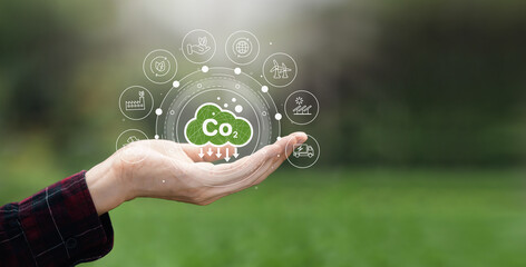 CO2 emission concept in farmers hands environmental icons global warming sustainable development...