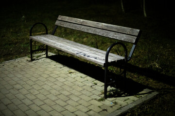 Bench in park at night. Place to relax in park.