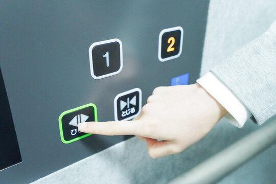 Young businesswoman use the elevator