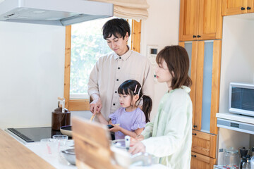 A happy family cooking together