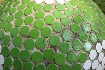 green background of mini circle red tiles design for modern concept