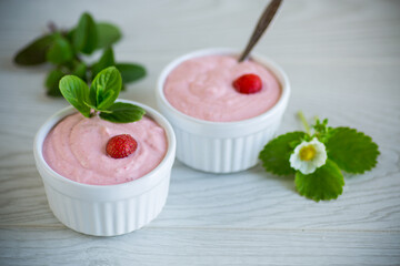 sweet curd mass whipped with fresh strawberries in a bowl