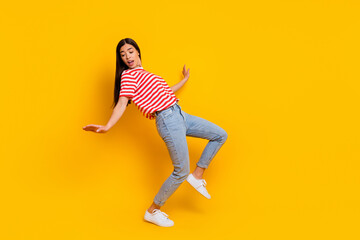 Full size of nice carefree person enjoy dancing spend free time weekend isolated on yellow color background