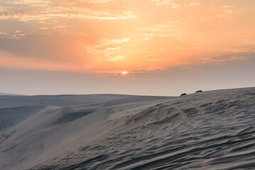 Sunset over Sealine sand dunes, Qatar, Middle East