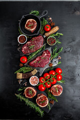 Raw beef filet Mignon steak on with pepper and salt, filet mignon. beef tenderloin steaks wrapped in bacon and thyme on dark background. top view