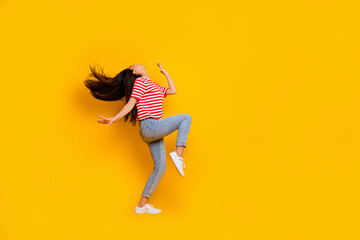 Full size profile photo of overjoyed lady enjoy partying dancing empty space isolated on yellow...