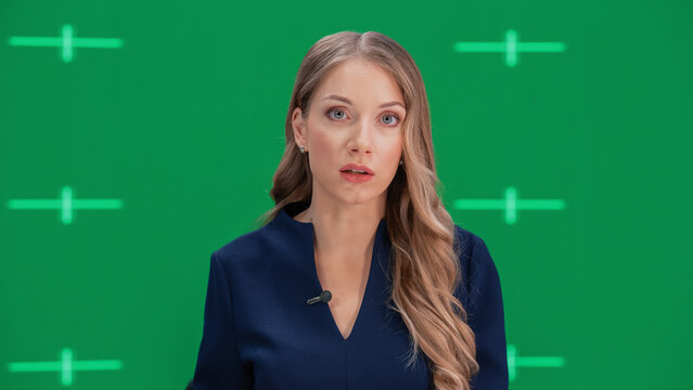Newsroom TV Studio Live News Program with Green Screen Background: Female Presenter Reporting, Talking. Television Cable Channel Anchorwoman. Network Broadcast Mock-up Playback with Tracking Markers