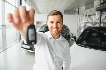 Man buying a car at a showroom