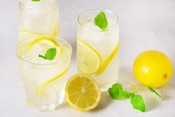 Natural Lemonade with Mint and Fresh Citrus on Light Gray Background Summer Refreshing Drink Horizontal