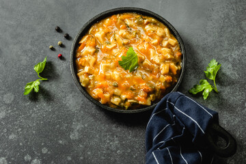 Mushroom vegan lentil stew  in cast iron skillet. Top view, copy space.