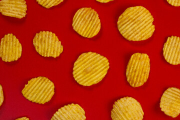 red background with corrugated Ruffled potato chips