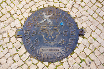 Sewer cover in Lisbon, Portugal