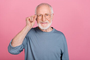 Photo of funny confident guy pensioner dressed grey pullover arm eyewear smiling isolated pink color background