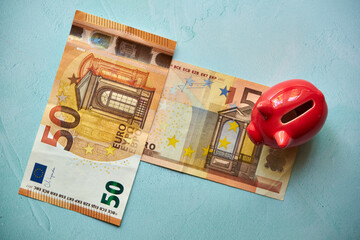 świnka skarbonka i banknoty euro  - obrazy, fototapety, plakaty