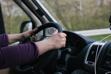 Hands on the steering wheel while driving 