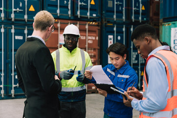 Shipping worker team update information together at the container yard as the background. shipment business teamwork. Professional team management and meeting.