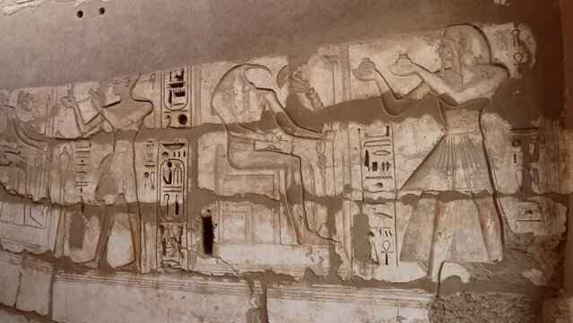 Ancient drawings on the walls of the Medinet Habu Temple in Luxor, Egypt