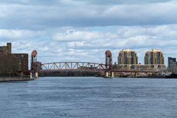 Obraz premium Steel Railroad Bridge with Rails over East River areal view . High - quality photo