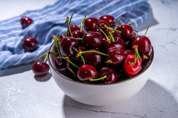 Bowl of fresh cherry fruit. Portion of fresh raw organic cherries on white background