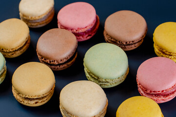 Row of delicious colorful French macaroons of different flavors, background, panoramic shot. High quality photo