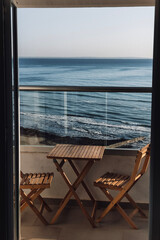 Cozy place at the balcony with sea background