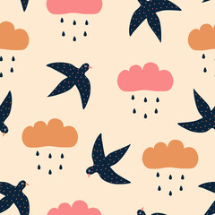 Colorful rain clouds and blue swallows hand drawn vector illustration. Adorable sky birds and raindrops in flat style seamless pattern for kids fabric or wallpaper.