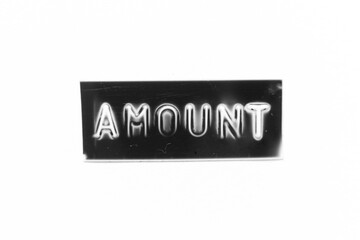 Black color banner that have embossed letter with word amount on white paper background
