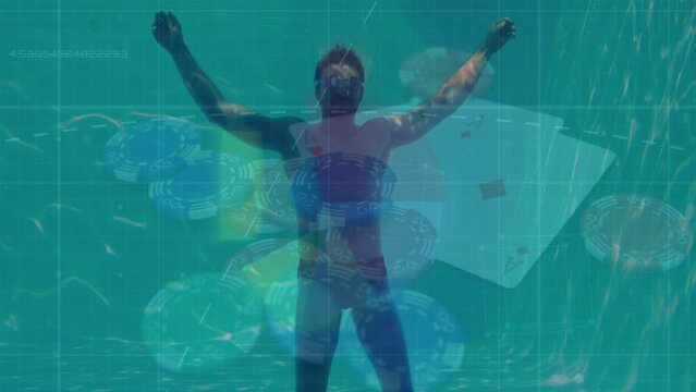 Animation of data and casio chips over caucasian man underwater swimming in pool - Powered by Adobe