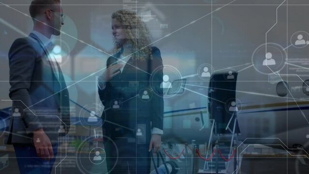 Animation of network of connections over caucasian businessman and businesswoman on airport