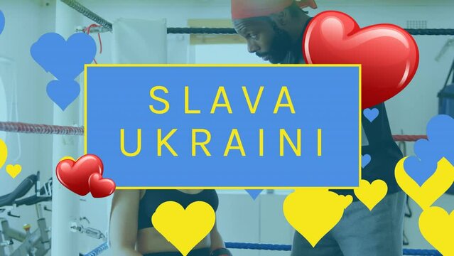 Animation of slava ukraini and heart floating over boxing ring