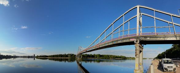 Kyiv, Ukraine - May 24, 2022: Landscape of the pedestrian bridge in Kiev. Summer time