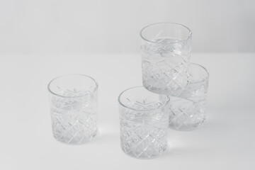 crystal glasses with refreshing water on grey background.