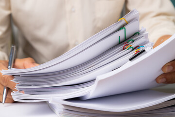 Stack overload document report papers, business paperless concept.