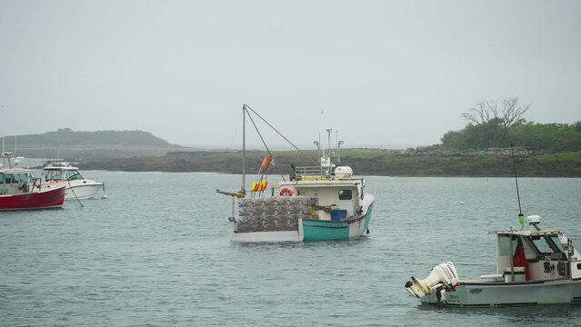 Classic lobster fishing boat in marina with fog rain and misty weather moody 4k 60p