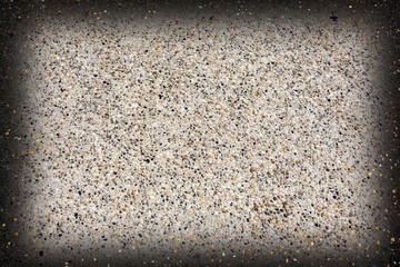 Lumière sur fond béton gravillonné 