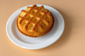cupcake with decorated squares on a background of orange