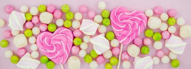 Caramel in the shape of a pink heart. happy Valentine's day. bright candies and marmalade