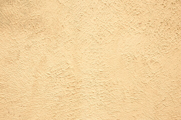 Beige background of the plastered wall. Close up.