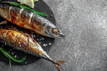 baked mackerel on stone background with copy space for your text