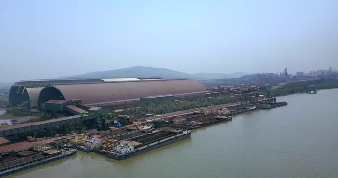 Bulk Cargo Ships On The Amba River, Docked At The Port Of Dolvi In Maharashtra, India. aerial
