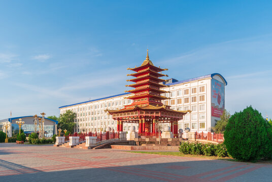 Elista, Russia - August 27, 2021: View of Lenin Square with the pagoda of Seven Days with prayer drum and fountain "Three lotus". Republic of Kalmykia.