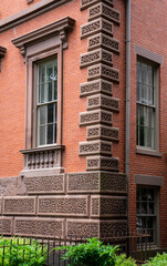 Naklejka premium Close up of terracotta tile detail on a historic building. High-quality photo showing a corner detail