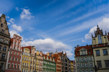 Fototapeta na wymiar View of old buildings of Market Square and cloudy sky in Wroclaw