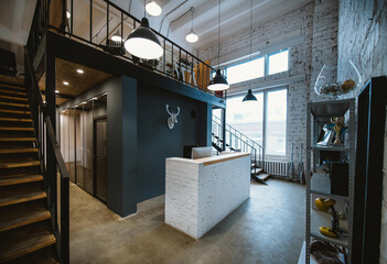 Modern spacious stylish office in loft style. Workspace without people.