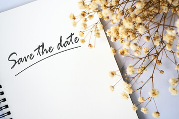 Save the date notice with baby's breath flower